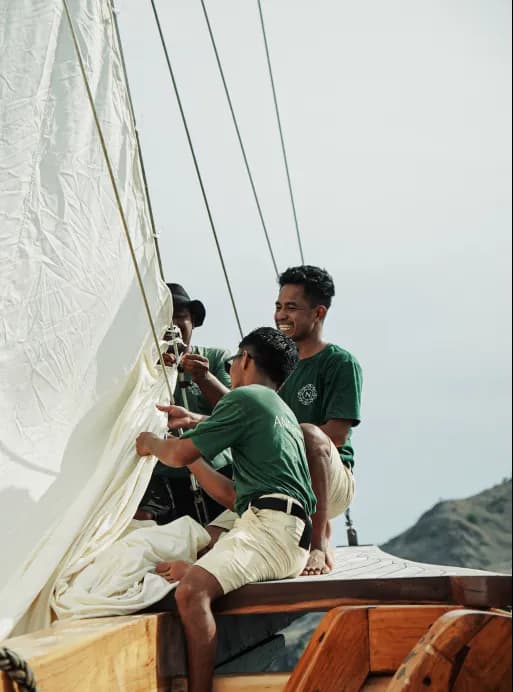 Phinisi crew handling sails