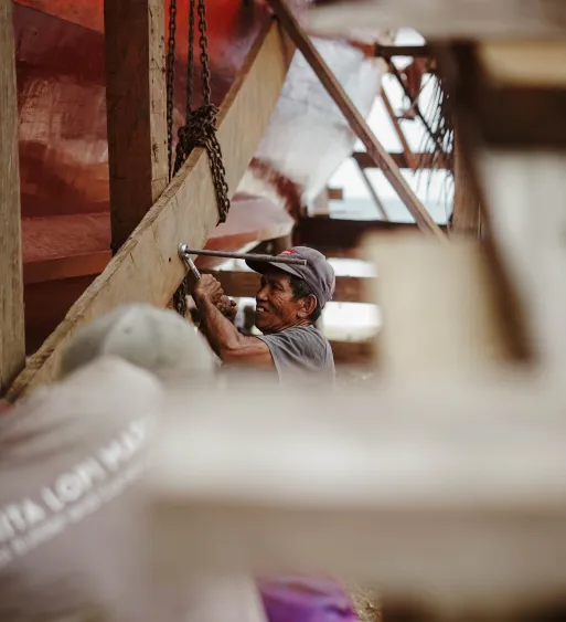 Phinisi crew handling sails